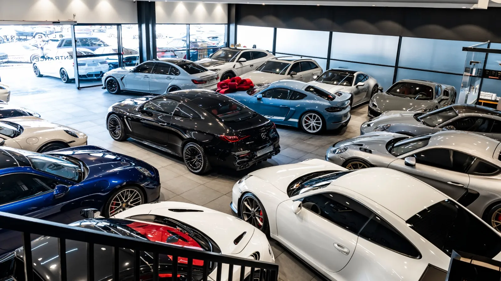 Luxury used car showroom at Blackline Motor Company in Dubai featuring Porsche, Mercedes-AMG and premium performance vehicles.